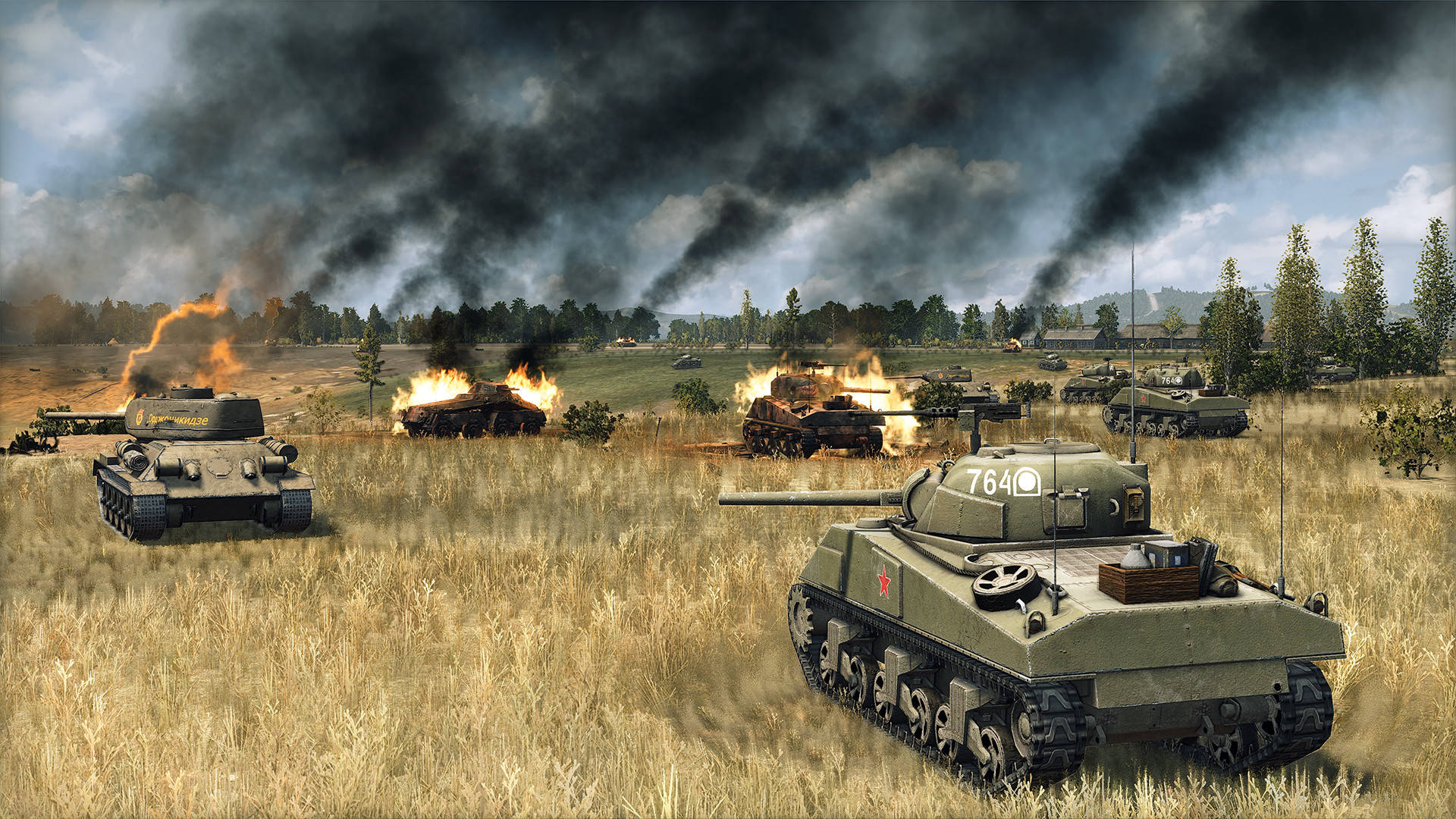 Best tank games: Steel Division 2. Image shows tanks in a field. Some of them are on fire.