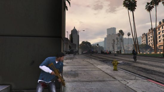 Best GTA 5 mods - a man is hiding from the cops behind a building.