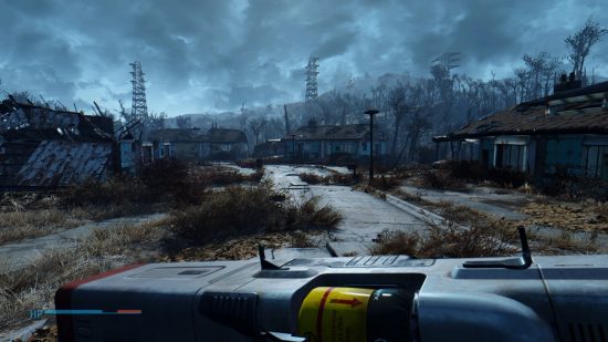 Best Fallout 4 mods: The lowered weapons mod in action, showing off the dilapidated landscape of the Wasteland