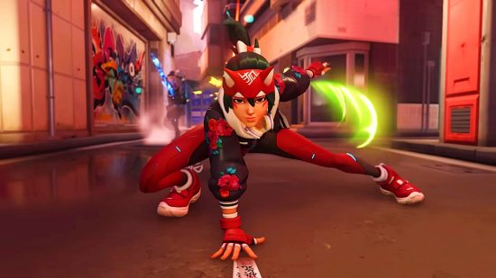 Overwatch 2 hero - Kiriko, a teal-haired woman in a red and black ninja outfit with fox ears on the headband, crouching down with one palm on the floor in a 'landing pose' and looking forward