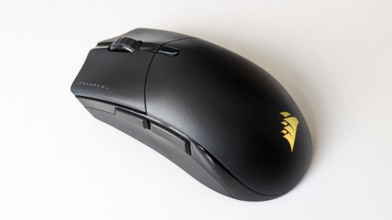 The best FPS wireless gaming mouse is the Sabre RGB Pro, seen here with the Corsair logo shining yellow on a white table