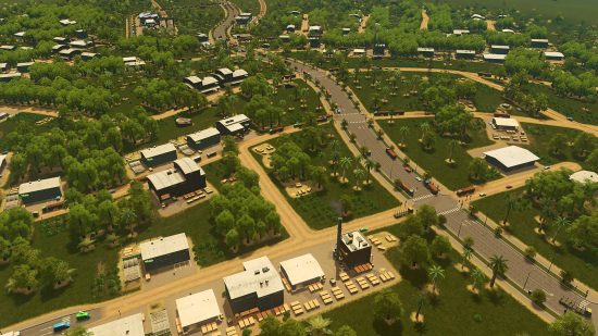 Games like Sims: An overhead view of a sprawling city, with plenty of green spaces offset by industrial factories.