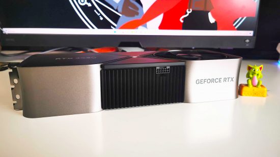 Nvidia RTX 4080 graphics card sitting horizontal on white desk