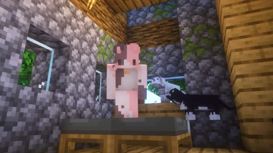 Cute Minecraft cat skin: A Minecraft player stands on a bed in a pink and white cat skin, as two Minecraft cats look up at them