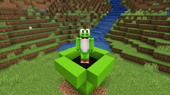 Best Minecraft skins: A player wears a bright green yoshi skin and stands on a replica of a mario pipe, made of bright green and black minecraft wool blocks.