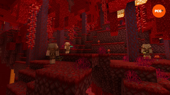 Red trees on a red ground a lit by an orange light as pigmen wander around a Crimson Forest, one of the Nether Minecraft biomes.