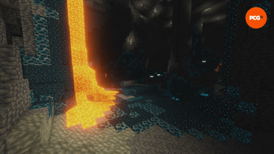 Bright blue sculk blocks are illuminated by lava in the Deep Dark Minecraft biome.