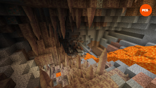 Dripstone stalagmites and stalactites are illuminated by lava in a Dripstone Cave, one of the underground Minecraft biomes.