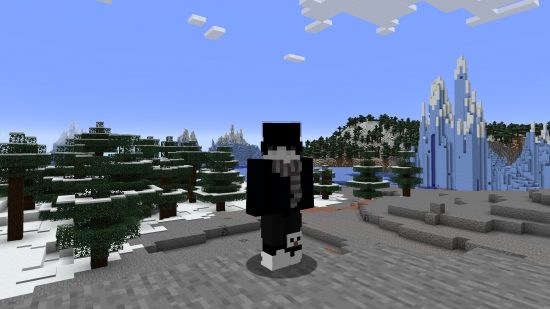 Best Minecraft skins: A young-looking player avatar wears a mostly black emo skin, with a long fringe covering their eyes, in front of a snowy taiga backdrop.