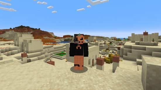 Best Minecraft skins: A player stands in a desert village wearing a cool Halloween skin, featuring a half pumpkin mask, and matching orange pants, with a black top.