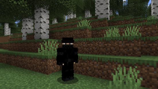 Best Minecraft skins: a Minecraft player avatar stands in a birch forest, with their entire body except their eyes covered in a black ninja costume.