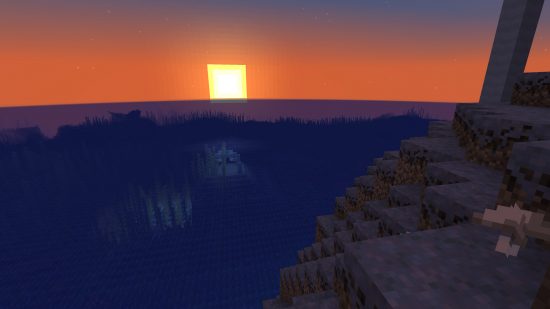 Minecraft seeds: Ocean Monument seed - An ocean monument seen from an island, with the sun setting over the sea.