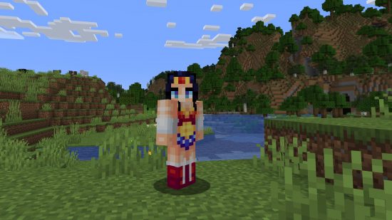 Bes Minecraft skins: A player stands in front of a lake wearing a cute Wonder Woman outfit, complete with long black hair, red boots, and bracelets of submission.