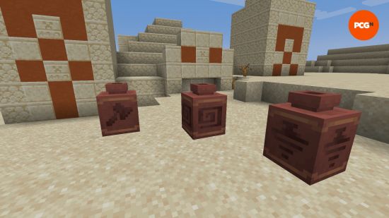Three decorative pots featuring the new pottery sherd designs from the Minecraft 1.21 Tricky Trials update.