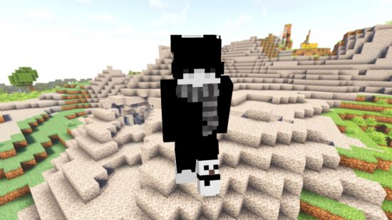 Лучшие скины Minecraft: молодой аватар игрока носит в основном черную эмо-скин с длинной челкой, закрывающей глаза, на фоне гравийных холмов.
