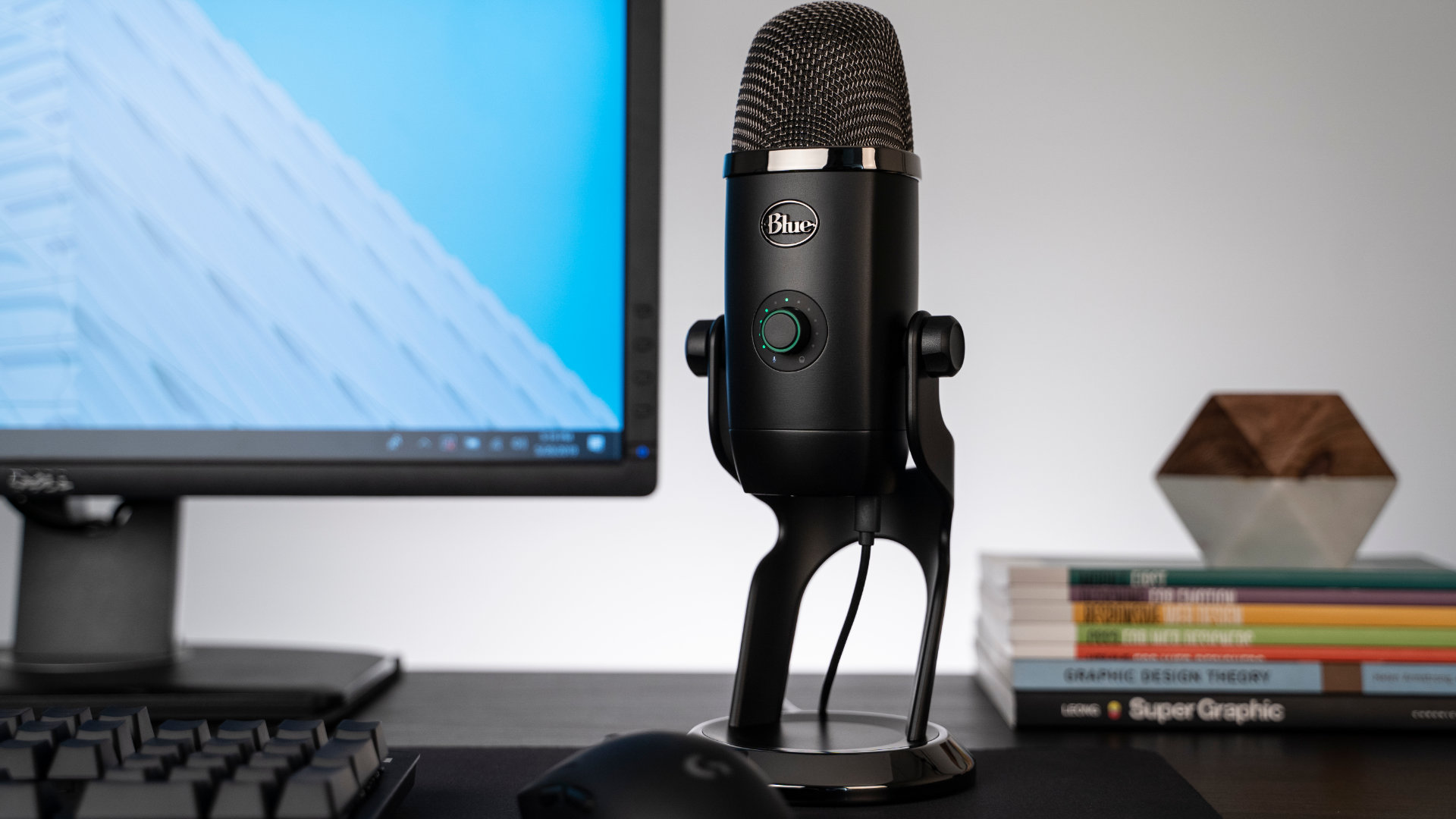 Best gaming microphone: the Blue Yeti X on a desk beside a monitor,