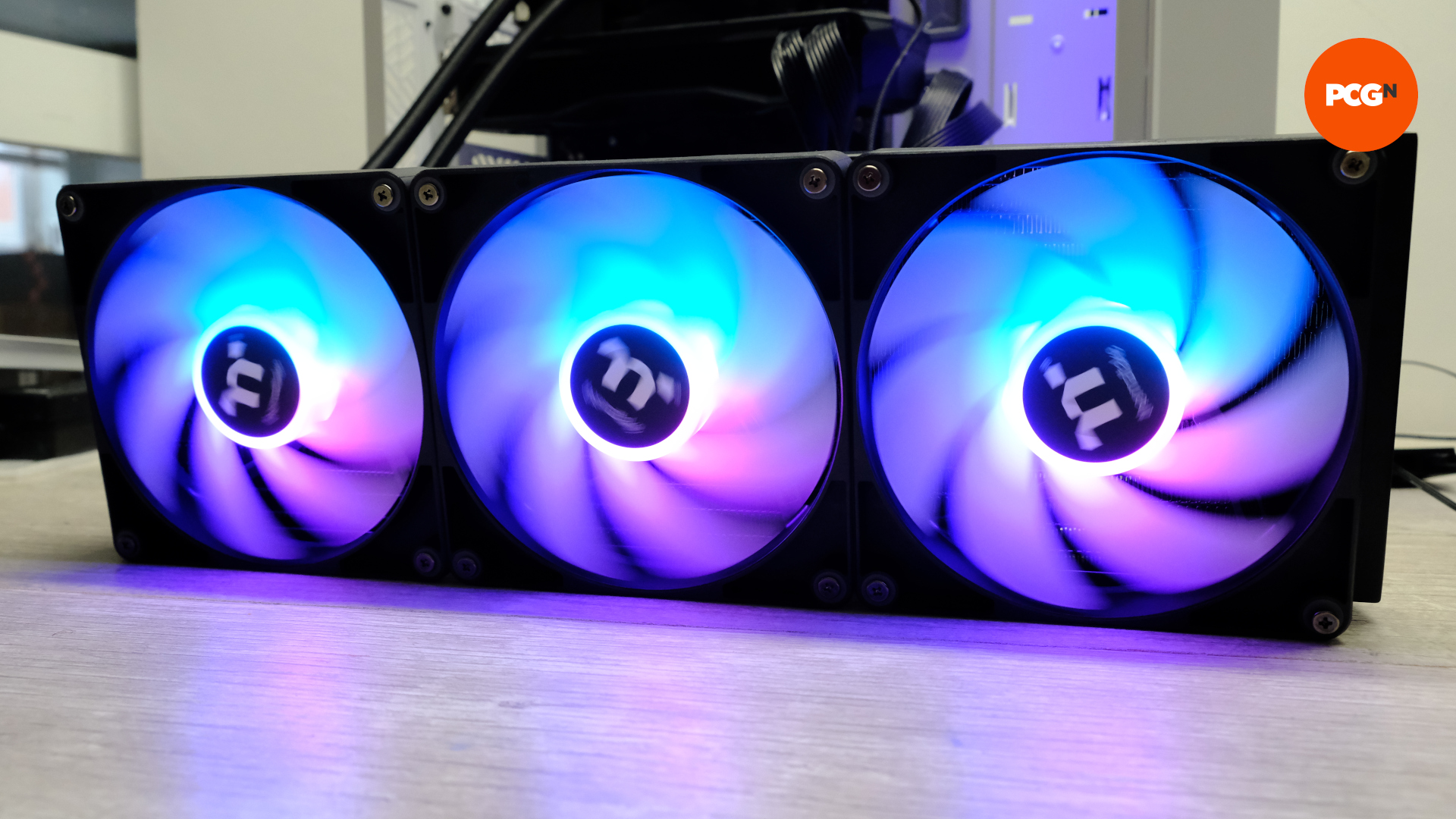 The Thermaltake TH420 V2 ARGB Sync AIO plugged in and the fans illuminated with RGB