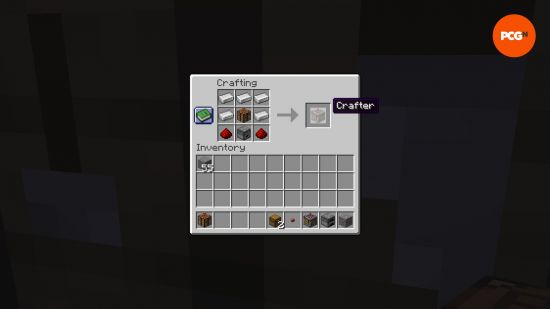 The Minecraft crafter recipe, showing five iron ingots, a crafting table, a dropper, and two redstone dust in a crafting grid.