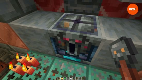 A player holds a trial vault up to an ominous trial vault in a Minecraft trial chamber.