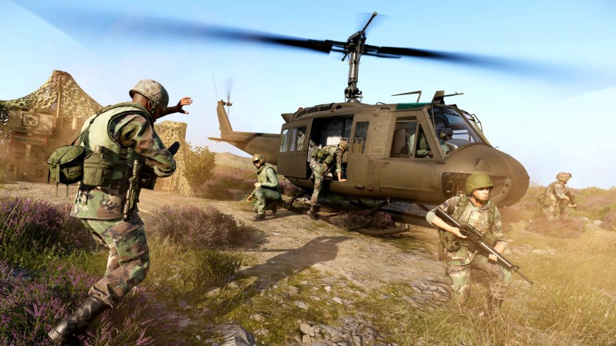 Arma Reforger - Soldiers in full military gear board a helicopter in a field.
