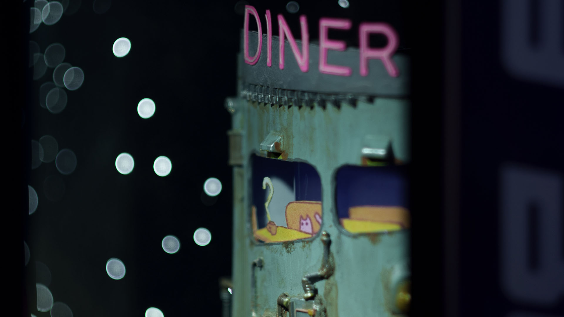 A close up of the case, focussing on a rusted looking sci-fi diner