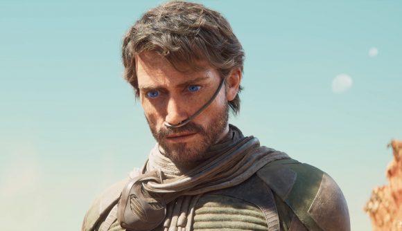 Dun Awakening: a man with short hair and a beard, with a tube going into his nose. The man has unnaturally blue eyes.