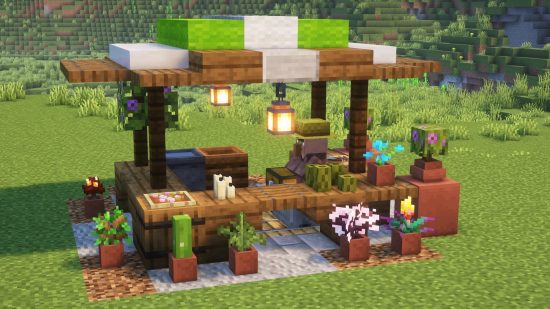 Un villageois se tient à l’intérieur d’un joli étal de marché, l’une des meilleures idées de construction de Minecraft.