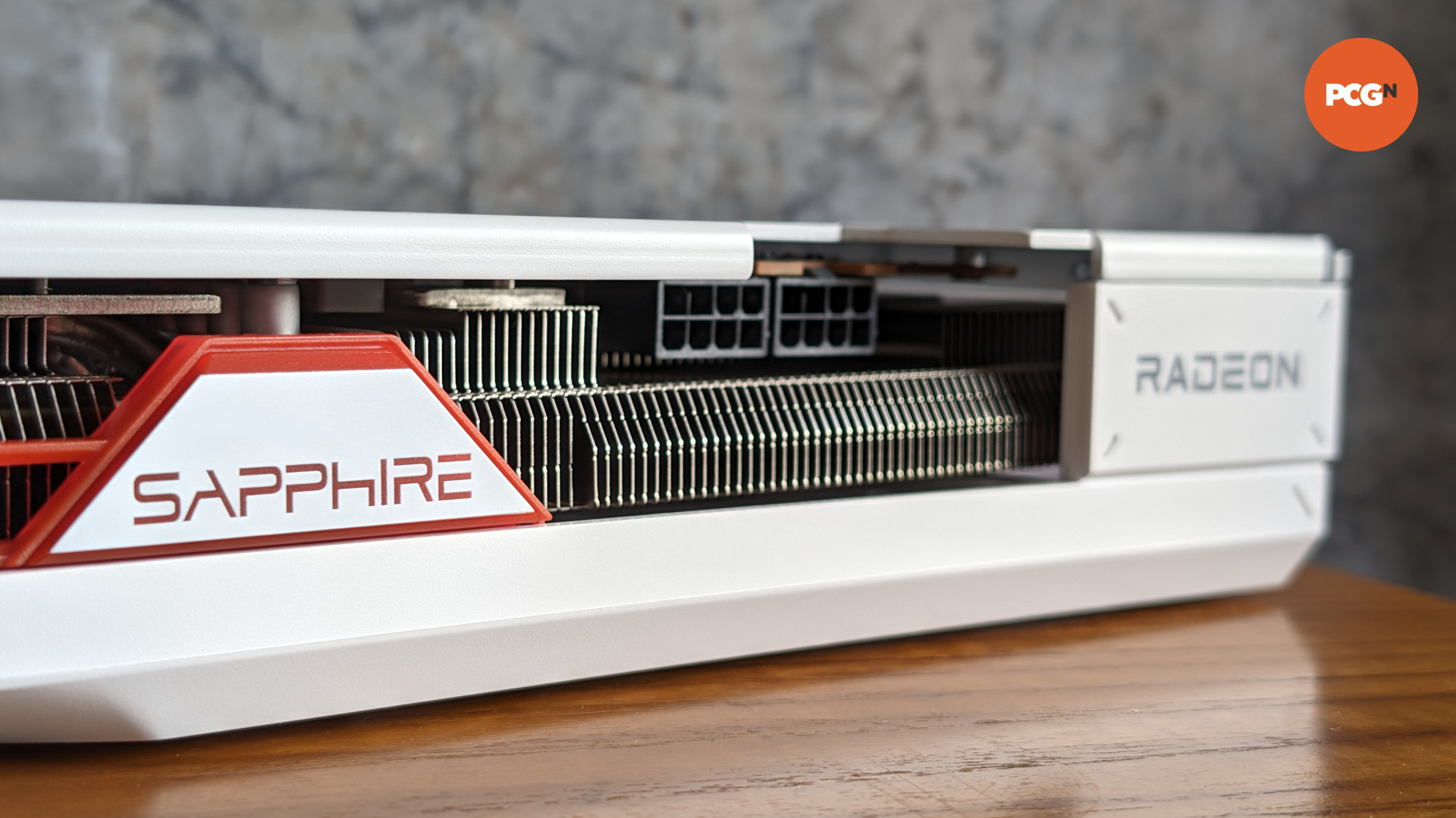 AMD Radeon RX 7900 GRE Sapphire Pure review: Top edge of white graphics card showing power connectors