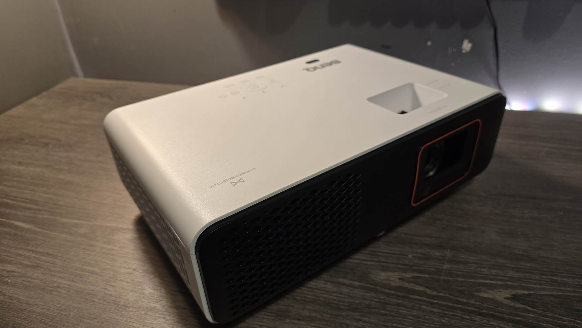 The BenQ X500i gaming projector on a gray tabletop