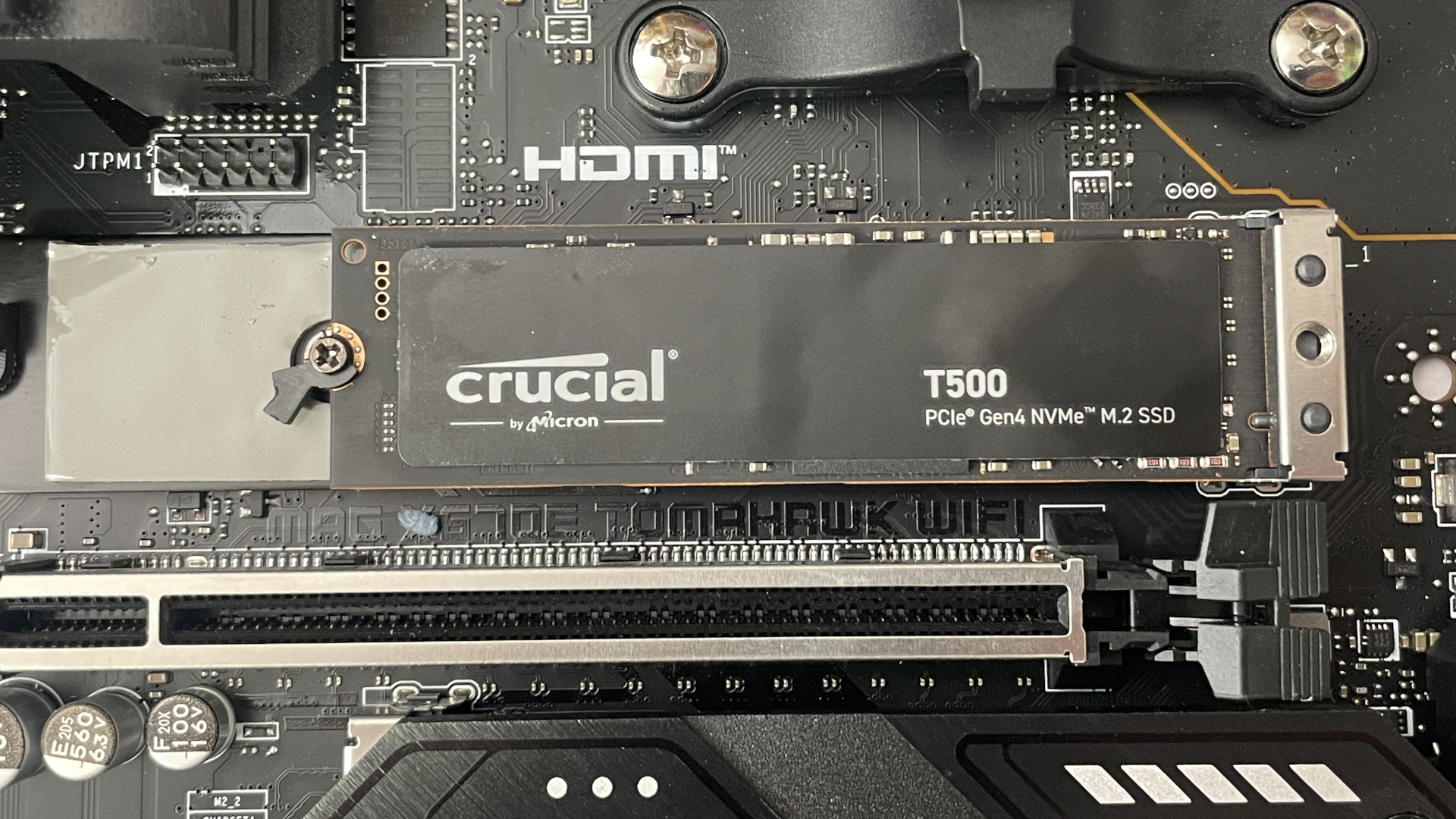 The Crucial T500 SSD seated in a motherboard