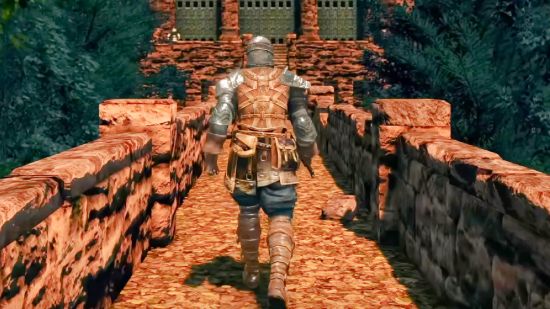 Dark Souls Remastered just got remastered again with new free mod: A knight, seen from behind, walking down a stone path, from Dark Souls Remastered.