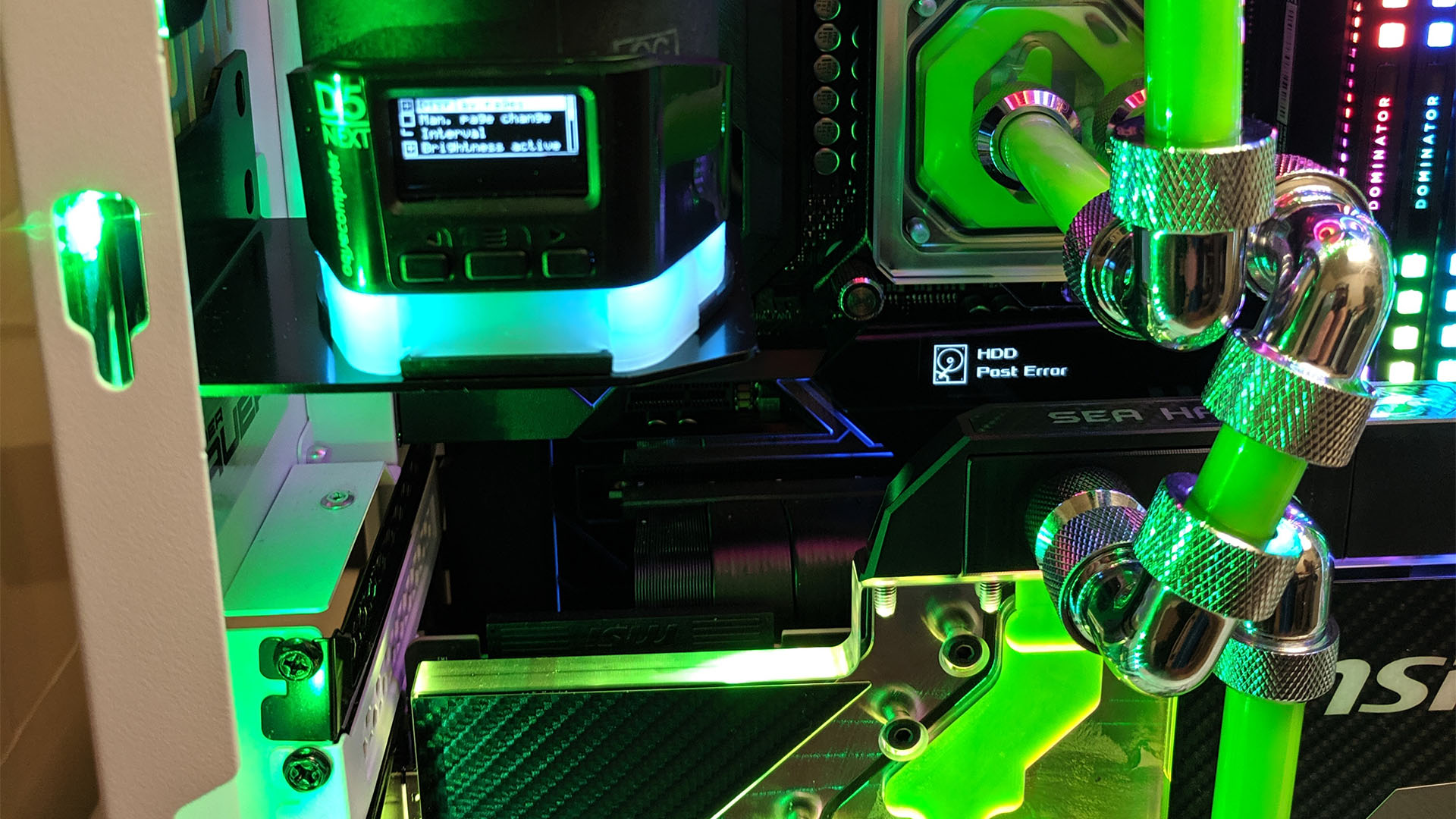 The green custom water cooling loop inside the gaming PC