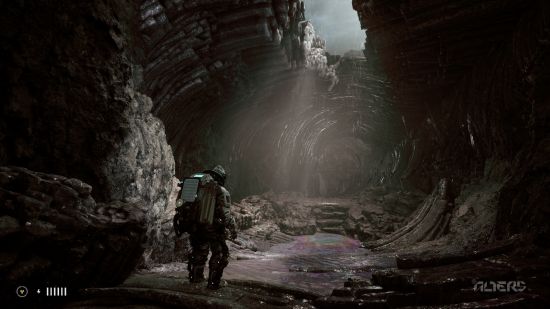 The Alters preview: a man wearing a spacesuit explores a dark cave.