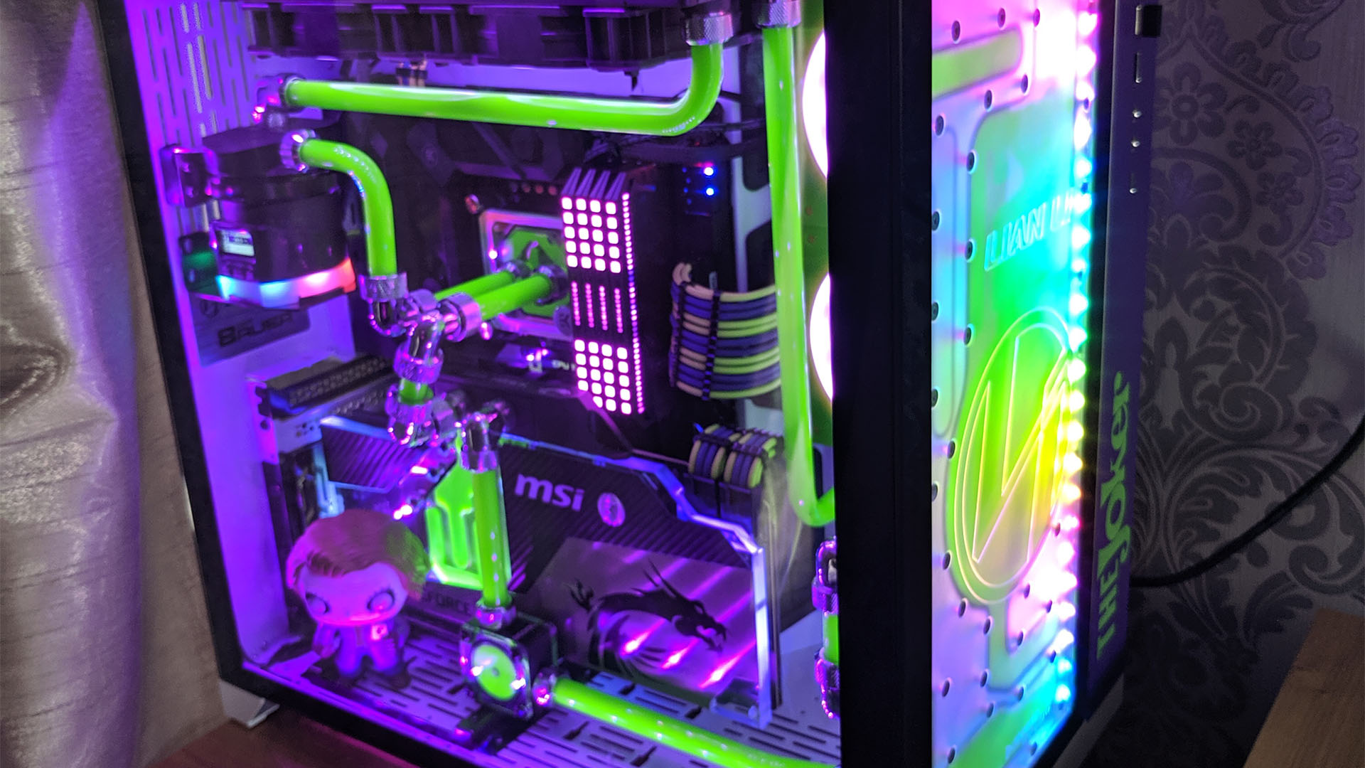 The Joker PC with green hardline tubing and purple RGB lighting