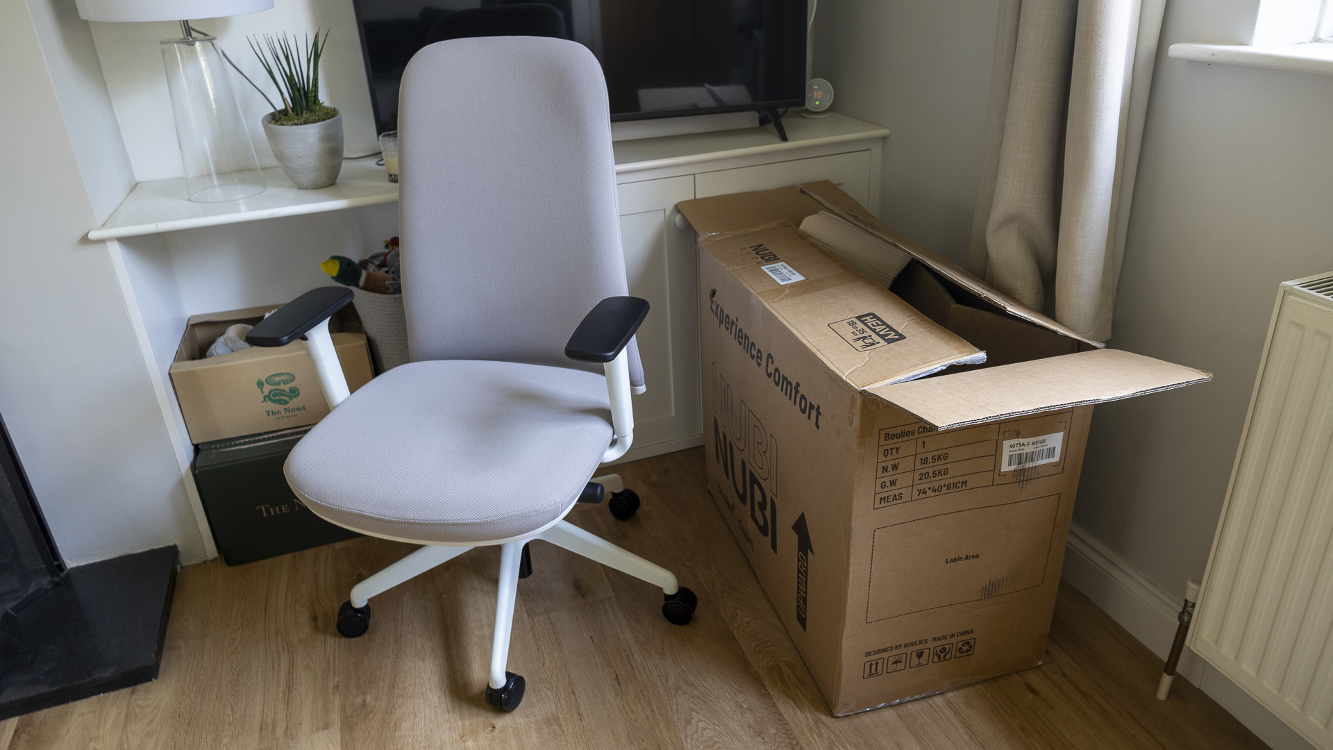 The Boulies NUBI Series chair next to the box