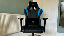 A black and blue gaming chair viewed front on