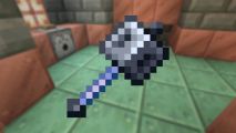 The Minecraft mace on a backdrop of a trial chamber, the only place where its crafting ingredients can be obtained.