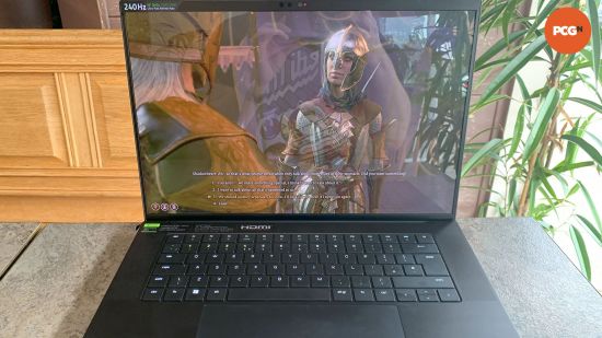 Razer Blade 16 (2024) review: Playing Baldur's Gate 3 with reflective screen next to cafe window