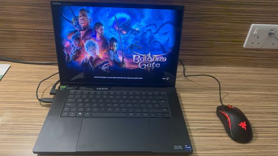 Razer Blade 16 (2024) review: Laptop playing Baldur's Gate 3 in hotel room