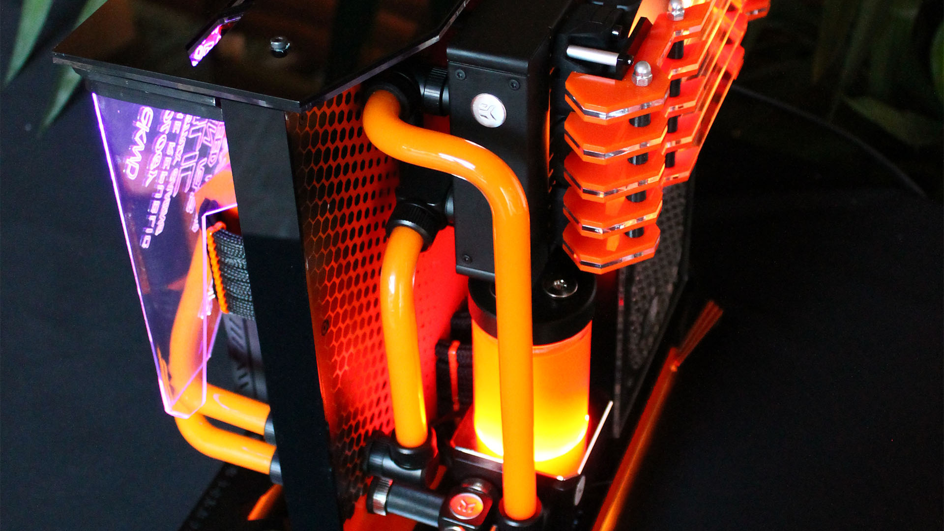 The back of the ROG Pagoda gaming PC with orange coolant running through pipes