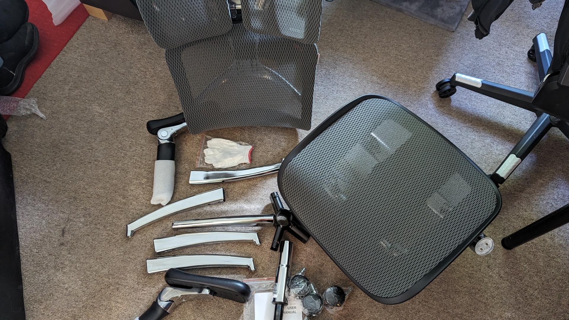 Sihoo S300 ergonomic office chair review image showing its parts mid-assembly.