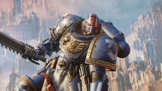 Space Marine 2 beta plans ditched to focus on finalizing the 40k game: An Ultramarine stands in front of a Forge World, chainsword raised high.