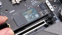 The WD_Black SN770 SSD being placed into the motherboard slot