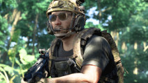 Gray Zone Warfare just made landing and extracting much easier: A soldier stands in a jungle, wearing sunglasses and wielding a gun.
