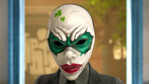 a woman in a mask with dark eyeliner, red lips, and green clovers