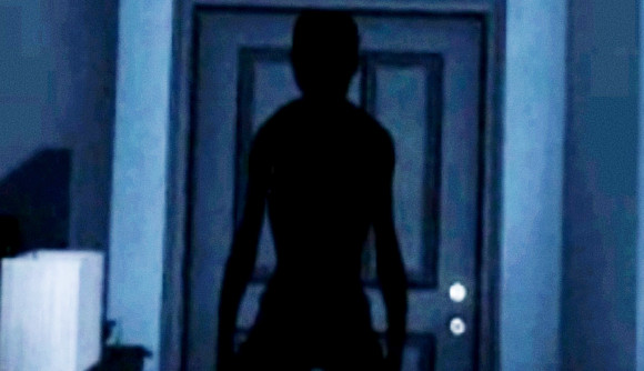 Phasmophobia price increase - A person-like shadow falls across a door in a dark house corridor.