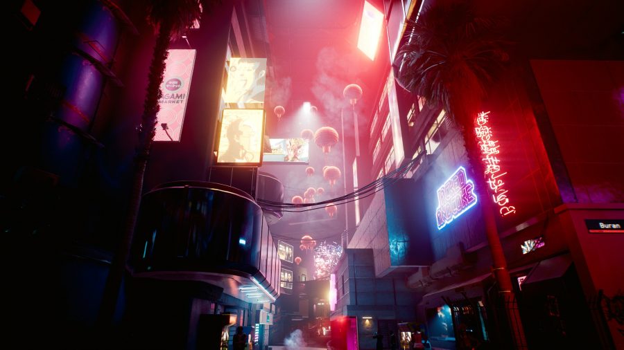 A busy shopping street lit by a pink neon in Cyberpunk 2077