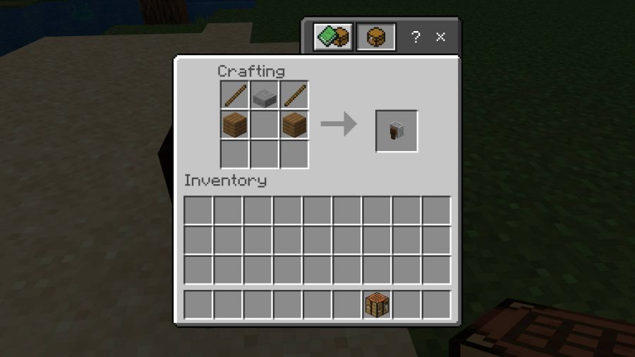 The recipe for crafting a Minecraft grindstone. It requires two planks, two sticks, and a stone slab.