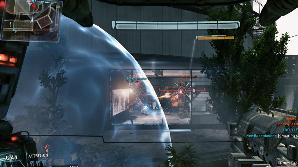 A Titan lands in front of the player's Titan as it puts flanking fire on an enemy inside a white glass-and-steel building.